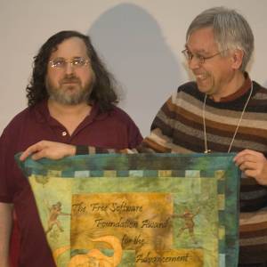 Richard Stallman presenting the Free Software Foundation Award for Advancement of Free Software to Wietse Venema, creator of Postfix.