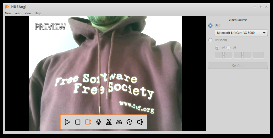 An image of the HUBAngl video streaming interface. The words 'PREVIEW' are in the top left corner, and a menu bar of icons is at the center-bottom of the screen. Dominating the image is the torso of a person wearing a maroon sweatshirt that reads 'Free Software Free Society.'