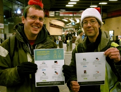 Santa's helpers (activists) about to distribute the Giving Guide to commuters