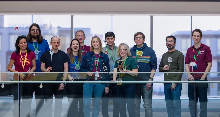 Photo of eleven of the FSF staff members during LibrePlanet 2023. From left to right: Jeanne, Michael, Greg, Anouk, Craig, Miriam, Devin, Dawn, Andrew, Ruben, Ian