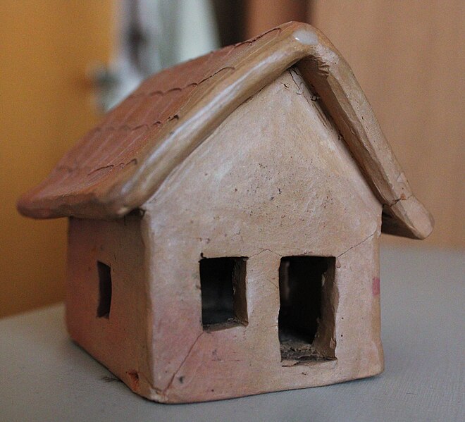 A nice photo of a small clay house.