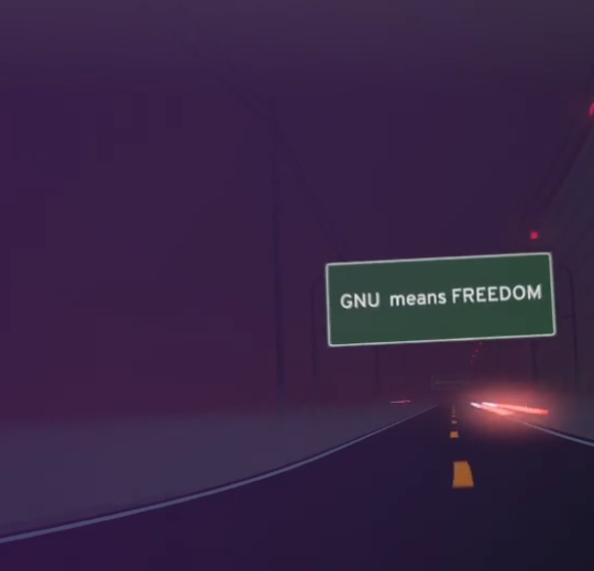 An animated road with a sign in the top right corner that reads 'GNU means freedom'