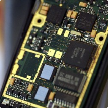 The inside of a phone, showing wires and a motherboard