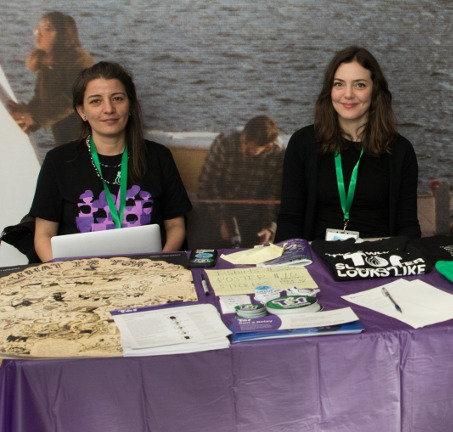 Isabela Bagueros and another Tor member at the Tor Project exhibitor table at LibrePlanet 2019