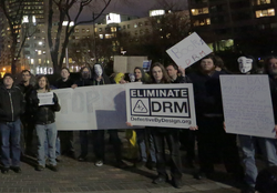 Activists at a protest against DRM.