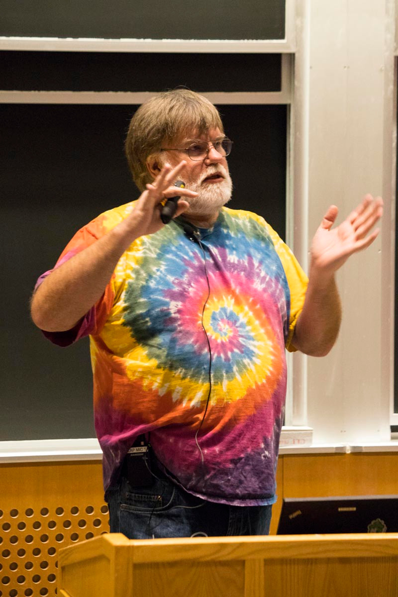 Bdale Garbee with a microphone speaking at a podium at the LibrePlanet 2019 conference