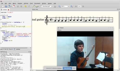 Article author and teacher Devin Ulibarri is shown holding a guitar and wearing headphones in a screenshot from his Jitsi Meet teaching session with a student